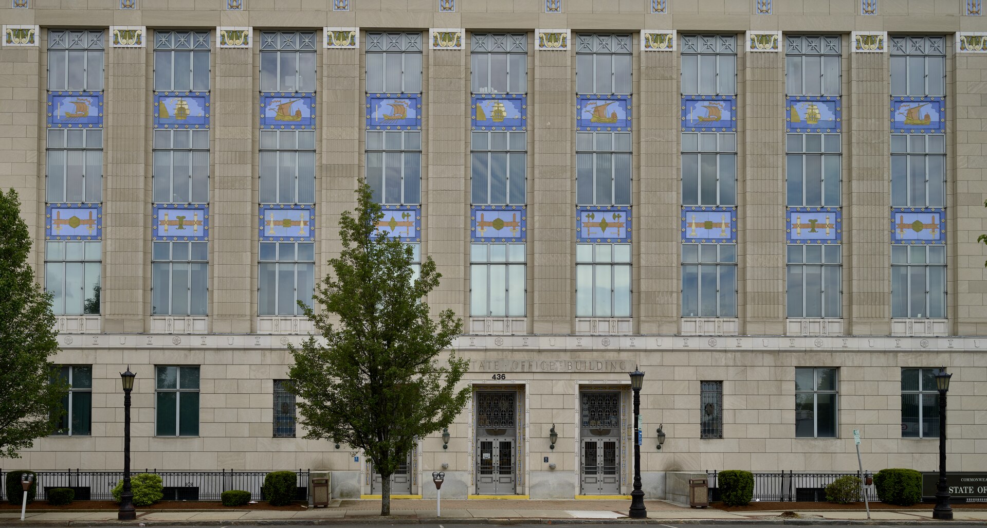 Art Deco facade of the Springfield State Office Building with painted ship panels above tall windows, the public work Springfield contractors bid
