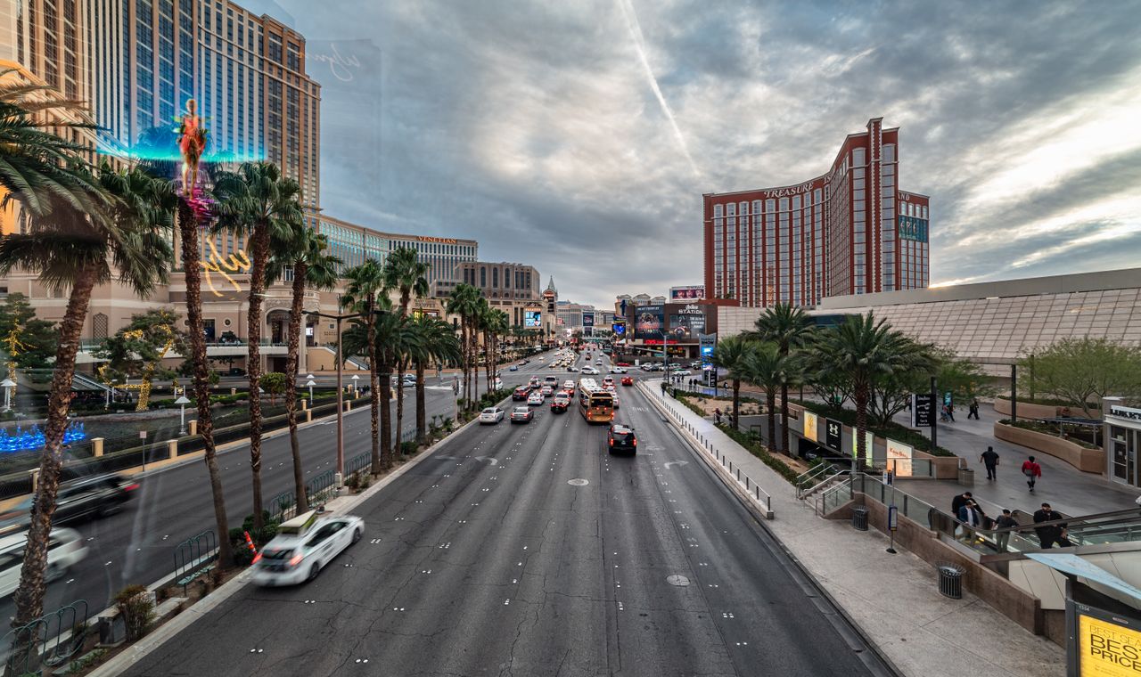 The Las Vegas Strip in daylight with resort towers and a palm-lined boulevard, the market FinTruction supports with job costing and WIP reporting