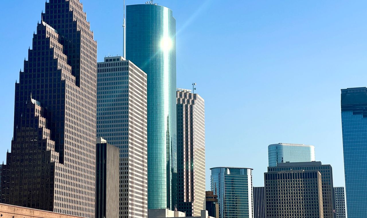 Downtown Houston high-rise towers in daylight, the Gulf Coast market FinTruction supports with construction accounting for contractors