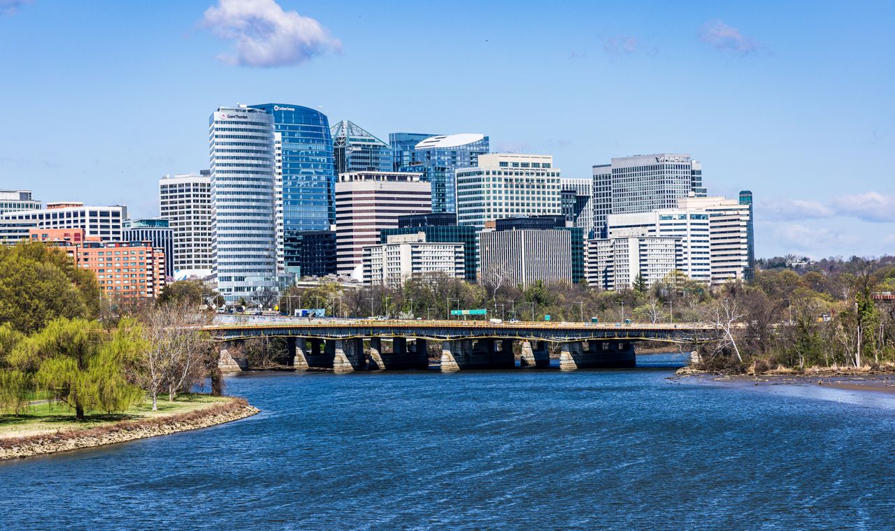 Office towers of the Rosslyn skyline in Arlington, Virginia rising above the Potomac River, the federal contracting market FinTruction serves