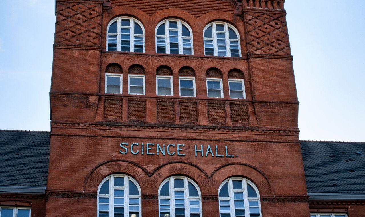 Red brick facade and arched windows of Science Hall on the UW-Madison campus, near the campus builds we job cost